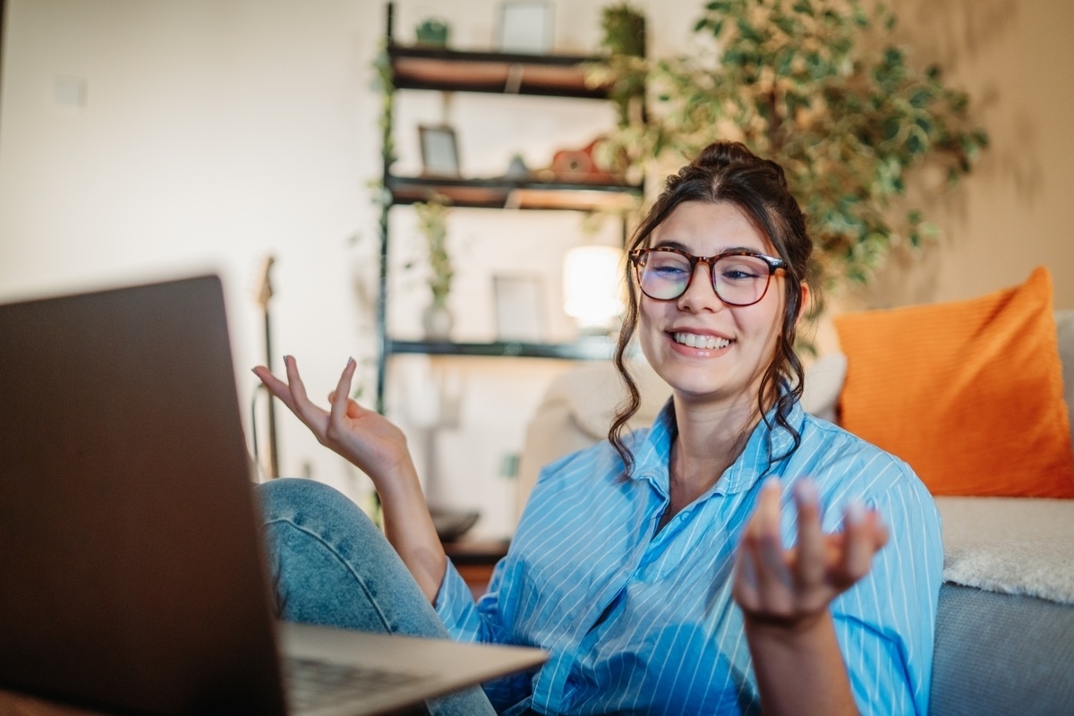 Adult woman engaged in an ADHD evaluation online through a telehealth video appointment at home