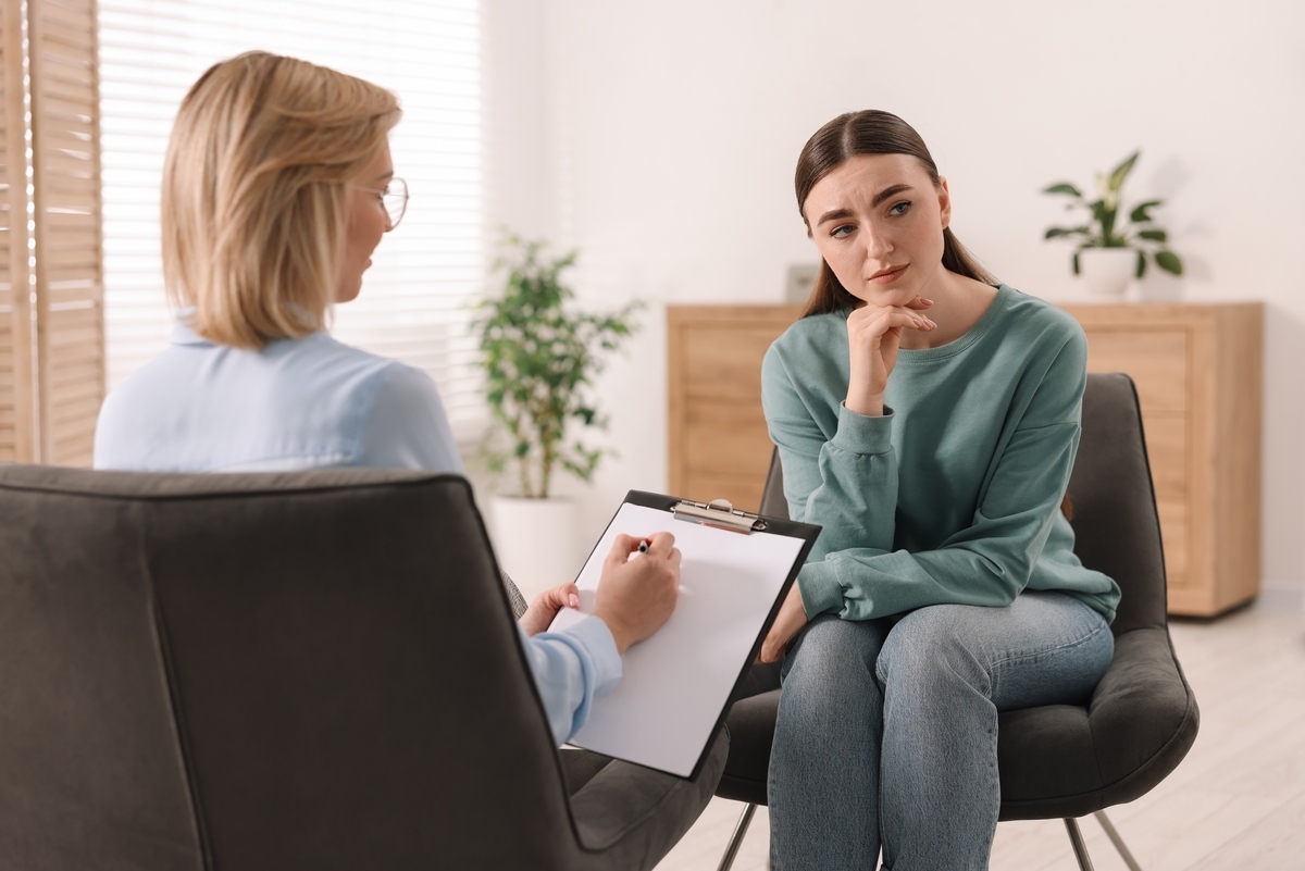 Woman during ADHD testing in Mesa, AZ with psychiatric provider taking notes