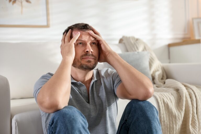 Adult appearing both restless and fixated representing the experience of having ADHD and OCD together