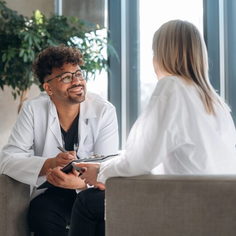 Adult patient discussing ADHD evaluation process with a psychiatric provider during a consultation