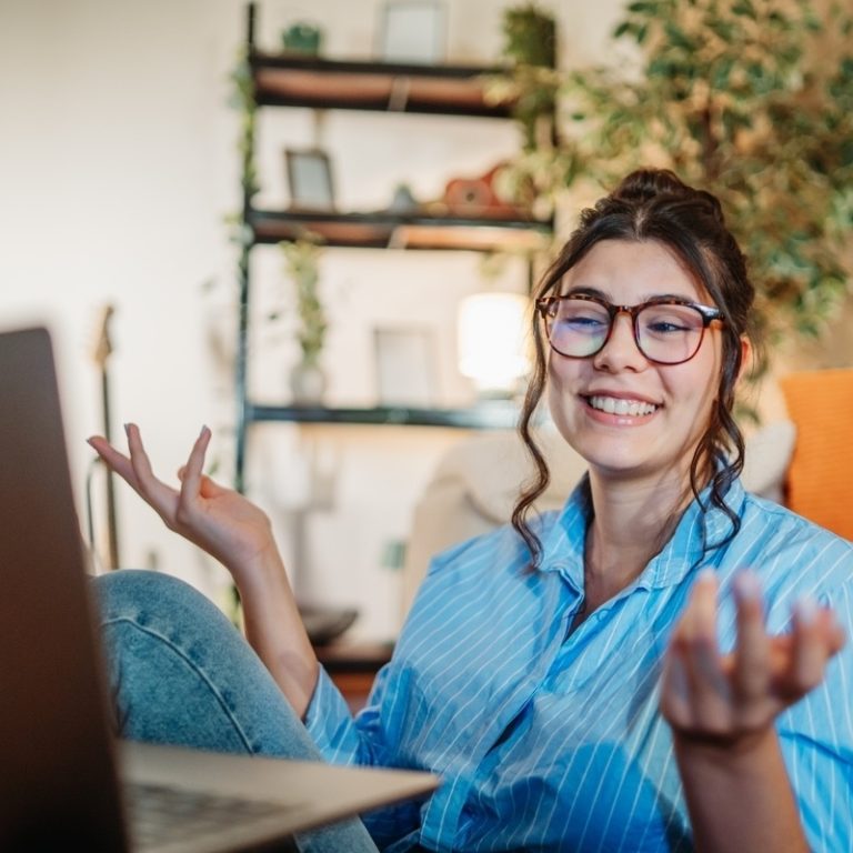 Adult woman engaged in an ADHD evaluation online through a telehealth video appointment at home
